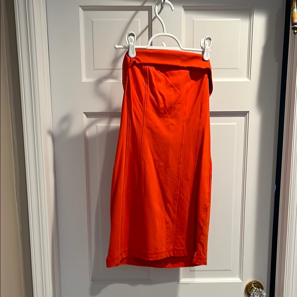 Urban Outfitters - Orange mini dress with stay in place rubber lining on top.